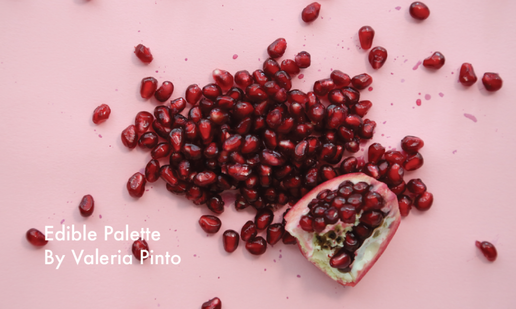 A top down view of pomegranates on a light pink background by Valeria Pinto (Edible Palette)